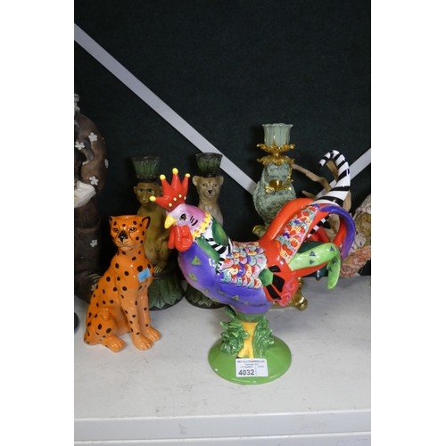 4032 - A quantity of various very colourful figures, candlesticks and other ornaments etc (one shelf)