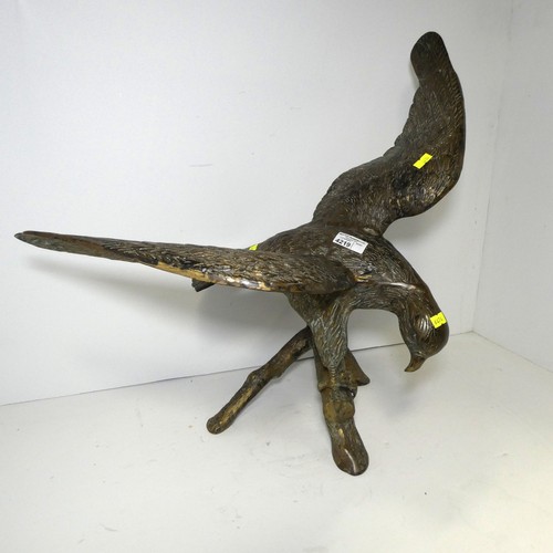 4219 - A large bronze coloured/brass figure of an eagle
