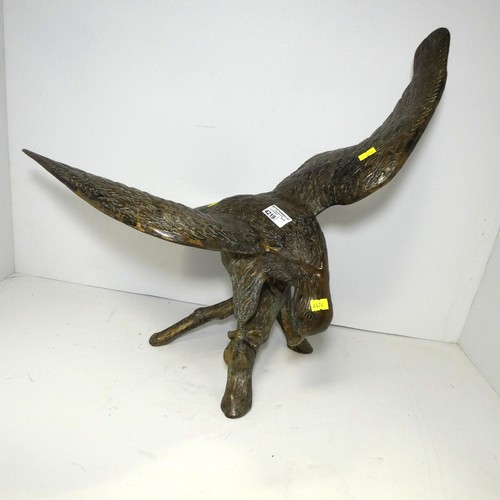 4219 - A large bronze coloured/brass figure of an eagle