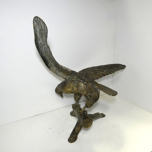 4219 - A large bronze coloured/brass figure of an eagle