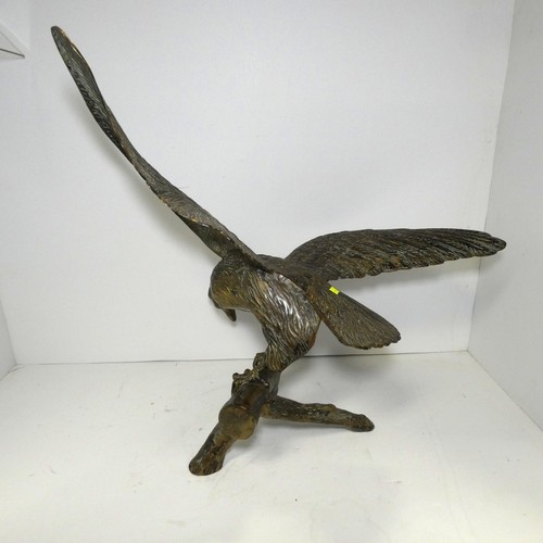 4219 - A large bronze coloured/brass figure of an eagle
