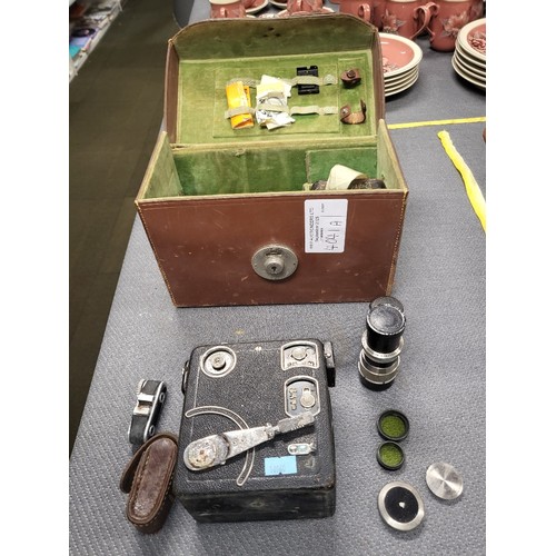 4041A - A Vintage Siemans 16mm Clockwork magazine Cine camera, with it original leather box and various acce... 