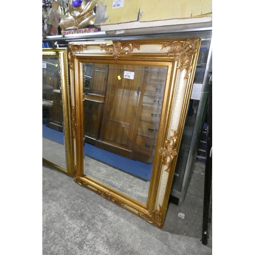 4738 - A large rectangular gilt framed beveled wall mirror