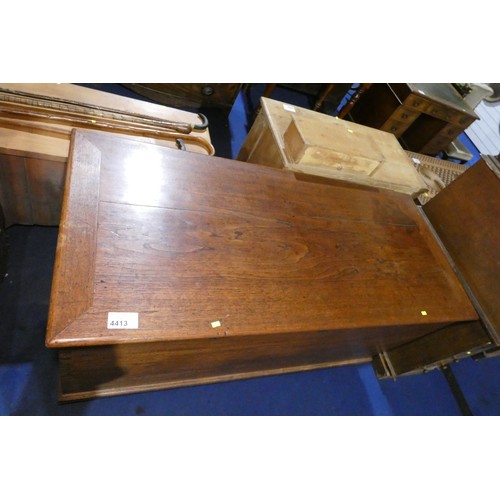 4413 - A very large hardwood storage chest with a lift lid, three heavy brass hinges and three lockings spa... 