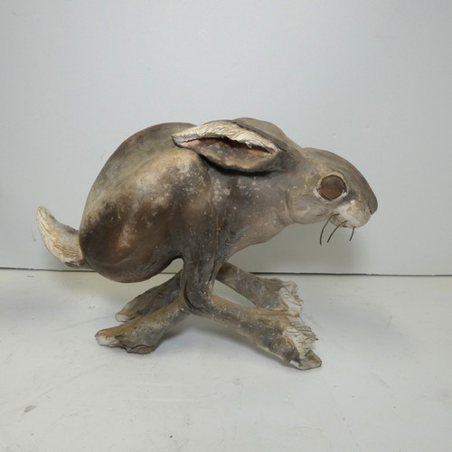 4039 - A studio pottery hare sculpture with unidentified signature underneath (see photographs) approx 18cm... 