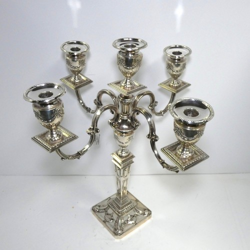 4156 - An Elizabeth 2nd very ornate embossed silver five branch candelabra with a square tapered column & s... 