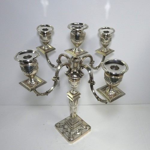 4156 - An Elizabeth 2nd very ornate embossed silver five branch candelabra with a square tapered column & s... 