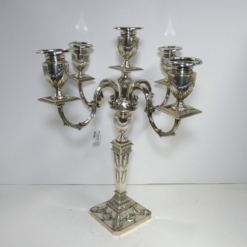 4156 - An Elizabeth 2nd very ornate embossed silver five branch candelabra with a square tapered column & s... 