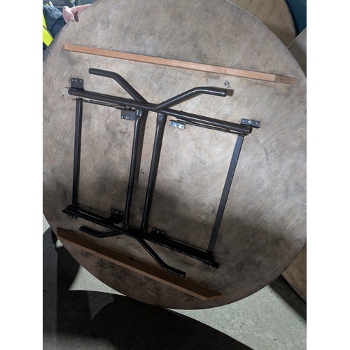 2027 - A round wooden topped metal framed folding catering type table approx 152cm