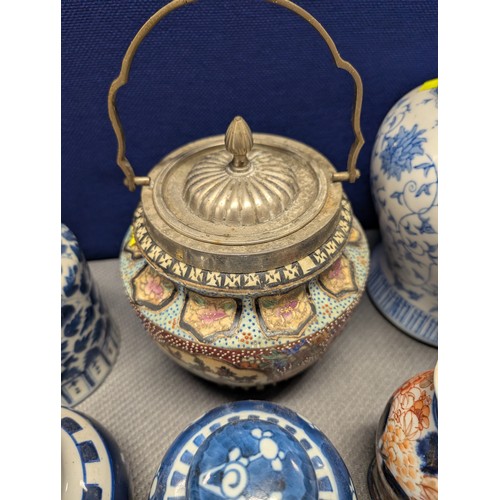 4221 - 2 Imari jars with covers and a quantity of miscellaneous decorative oriental jars and pots etc