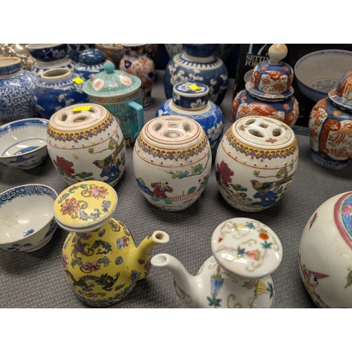 4221 - 2 Imari jars with covers and a quantity of miscellaneous decorative oriental jars and pots etc