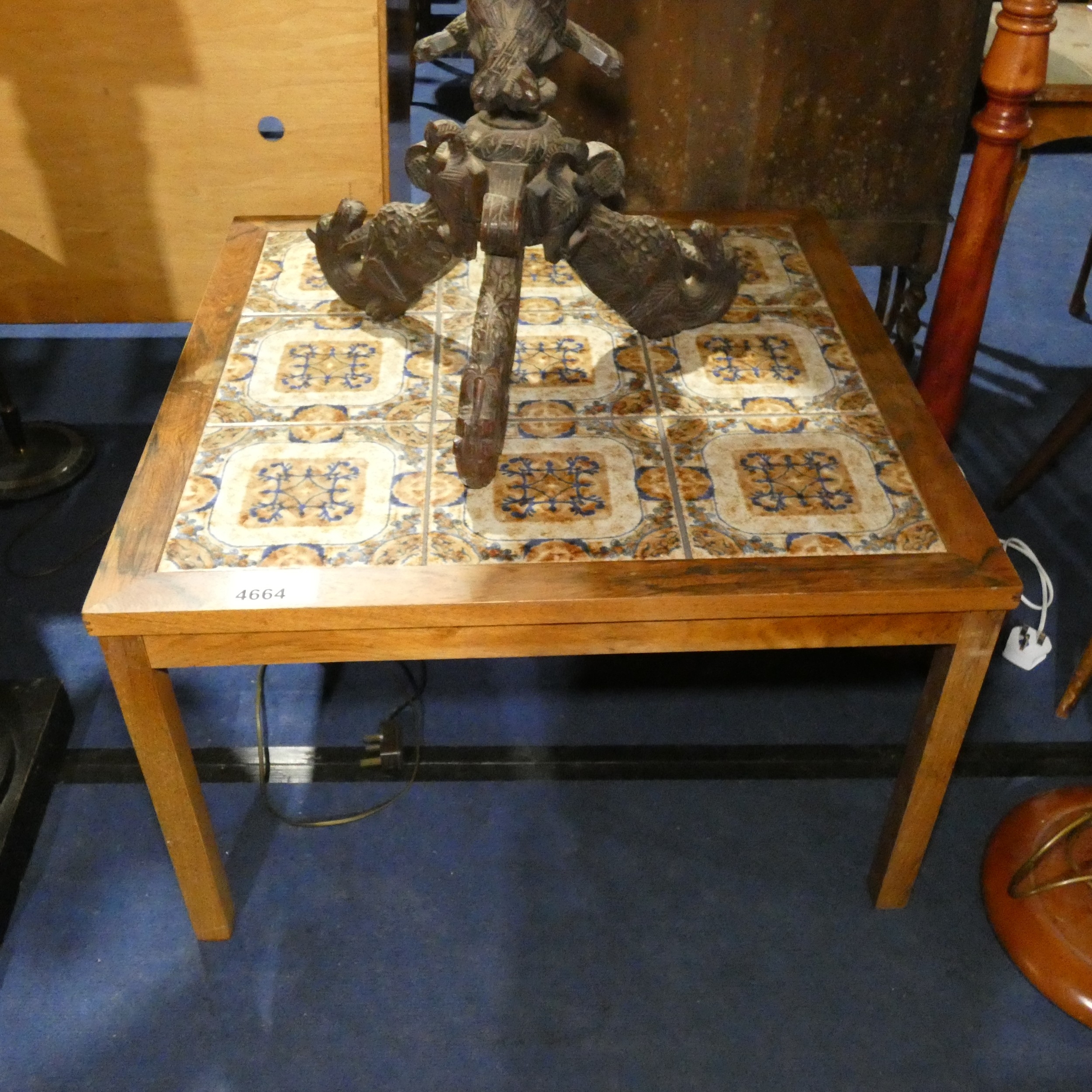 A mid 20th century rectangular tiled top coffee table