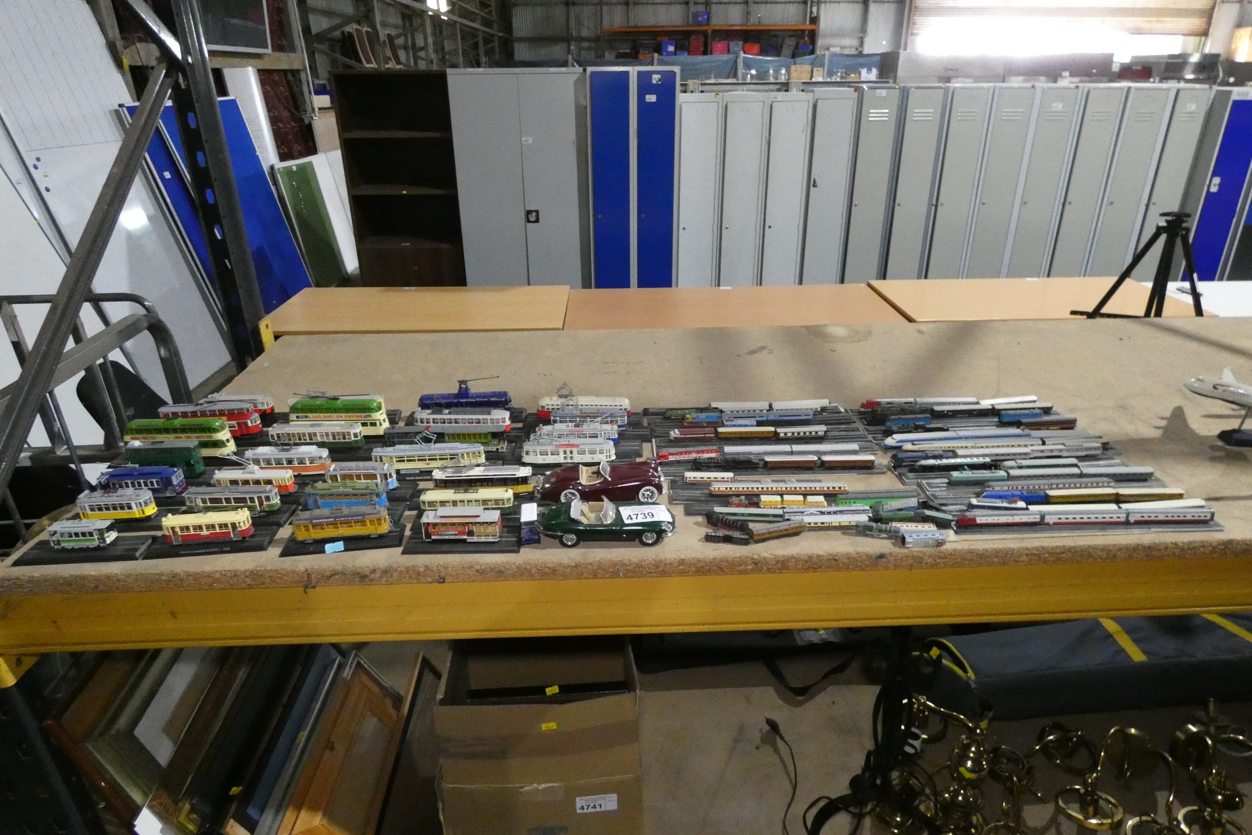 A quantity of miniature model trams, railways and cars