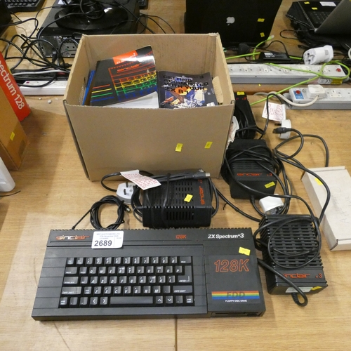 A Sinclair ZX Spectrum +3 128k with floppy drive, 4x power adapters ...
