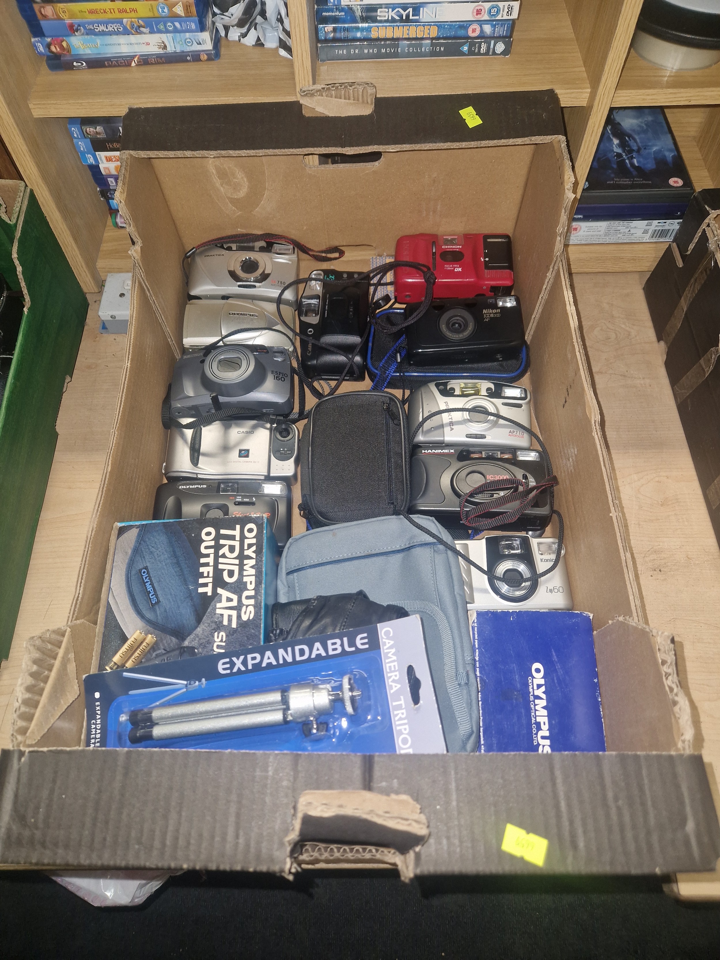 A crate containing a quantity of various 35mm cameras including Canon ...