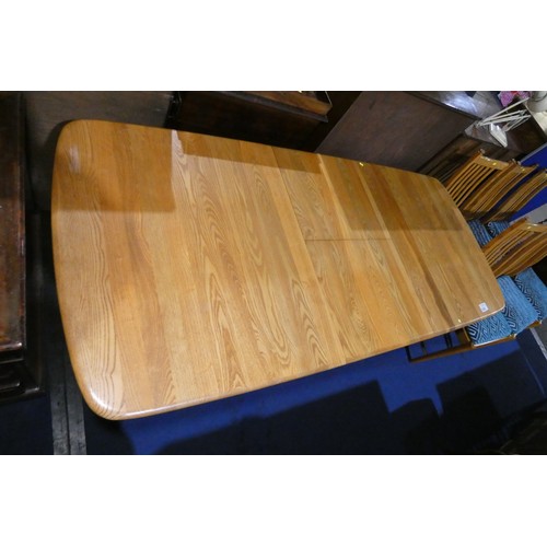 3383 - A mid 20th century Ercol blonde wood rectangular top extending dining table, approximately 205 cm lo... 