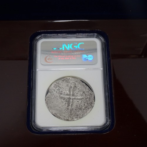 3134 - A boxed silver cob coin from the Sao Jose shipwreck, authenticated by the Numismatic Guaranty Compan... 