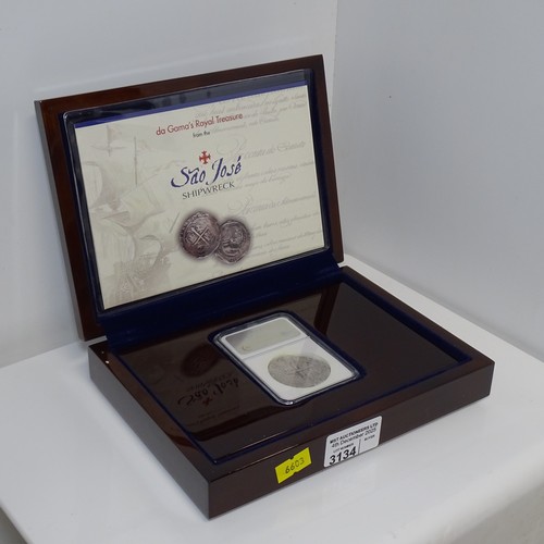 3134 - A boxed silver cob coin from the Sao Jose shipwreck, authenticated by the Numismatic Guaranty Compan... 