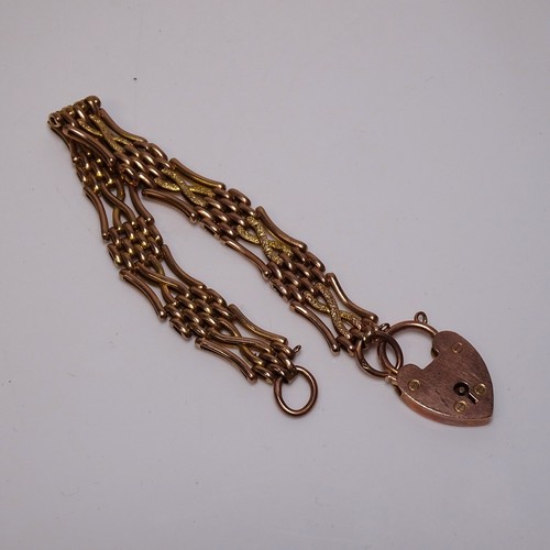 3155 - A 9 carat gold link bracelet with a heart-shaped clasp, weight approximately 13 grams