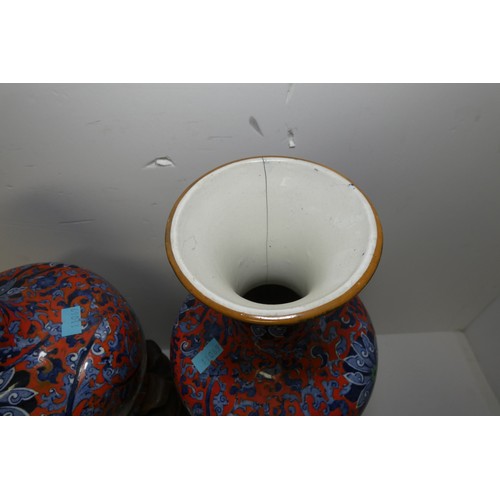 3216 - A pair of blue and red floral patterned vases by Chung with two heavy decorative wooden bases