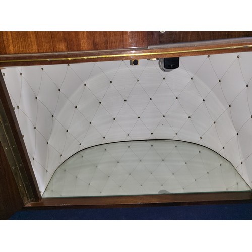 3410 - A 1960s vintage wooden cased radiogram/cocktail cabinet with sliding doors enclosing record  playing... 