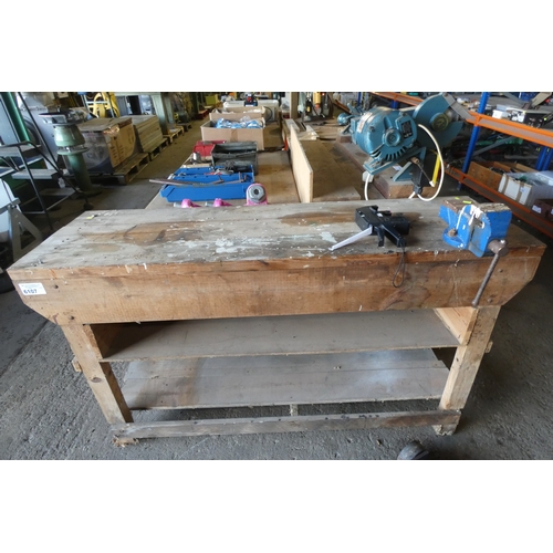 6107 - 1 x wooden workbench approx 150cm wide fitted with a bench vice