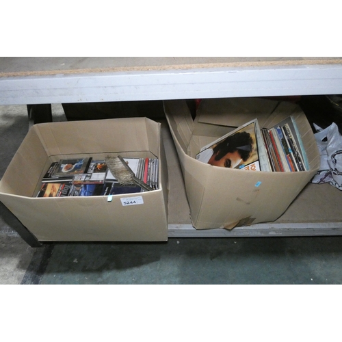 Two boxes containing various vinyl records and CDs