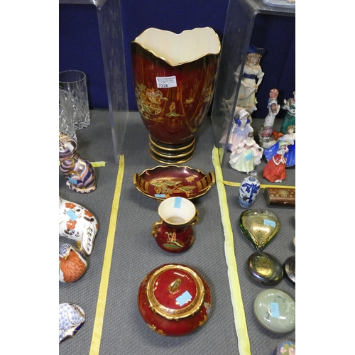 A large ruby red decorated ceramic Carlton ware vase, a small similar ...