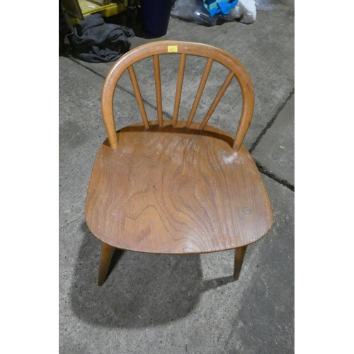 7391 - A mid 20th century Ercol blonde wood small writing desk with two trinket drawers, one drawer below a... 