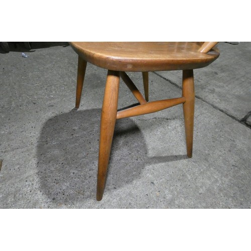 7391 - A mid 20th century Ercol blonde wood small writing desk with two trinket drawers, one drawer below a... 