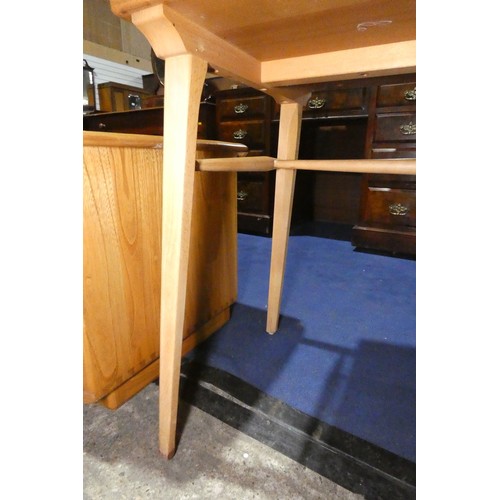 7391 - A mid 20th century Ercol blonde wood small writing desk with two trinket drawers, one drawer below a... 