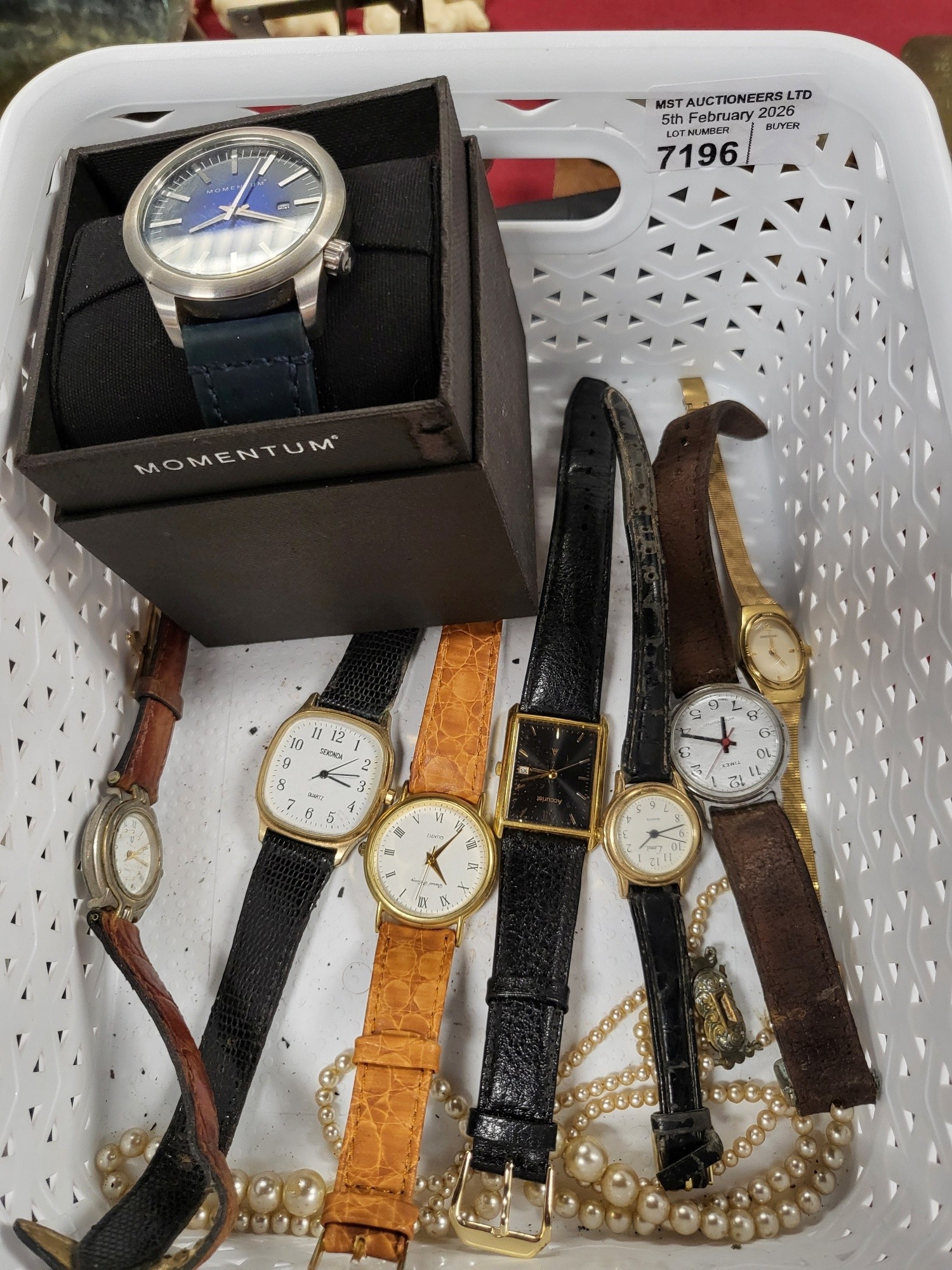 A quantity of miscellaneous wrist watches (plastic container not included)