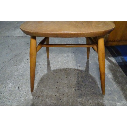 7391 - A mid 20th century Ercol blonde wood small writing desk with two trinket drawers, one drawer below a... 