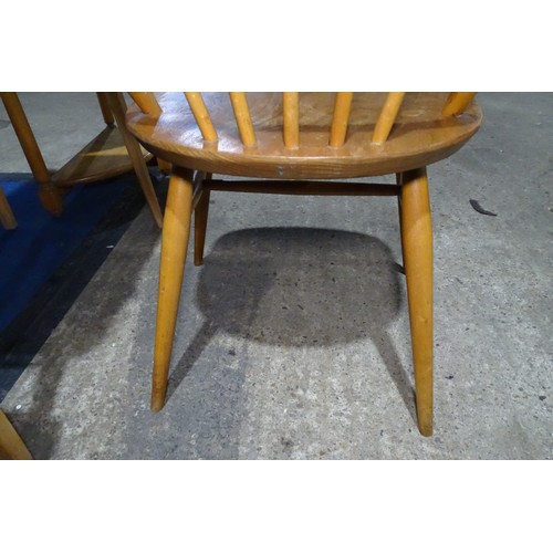 7391 - A mid 20th century Ercol blonde wood small writing desk with two trinket drawers, one drawer below a... 