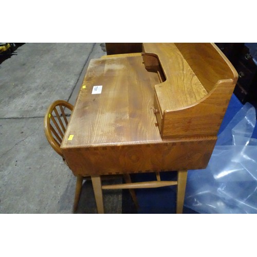 7391 - A mid 20th century Ercol blonde wood small writing desk with two trinket drawers, one drawer below a... 