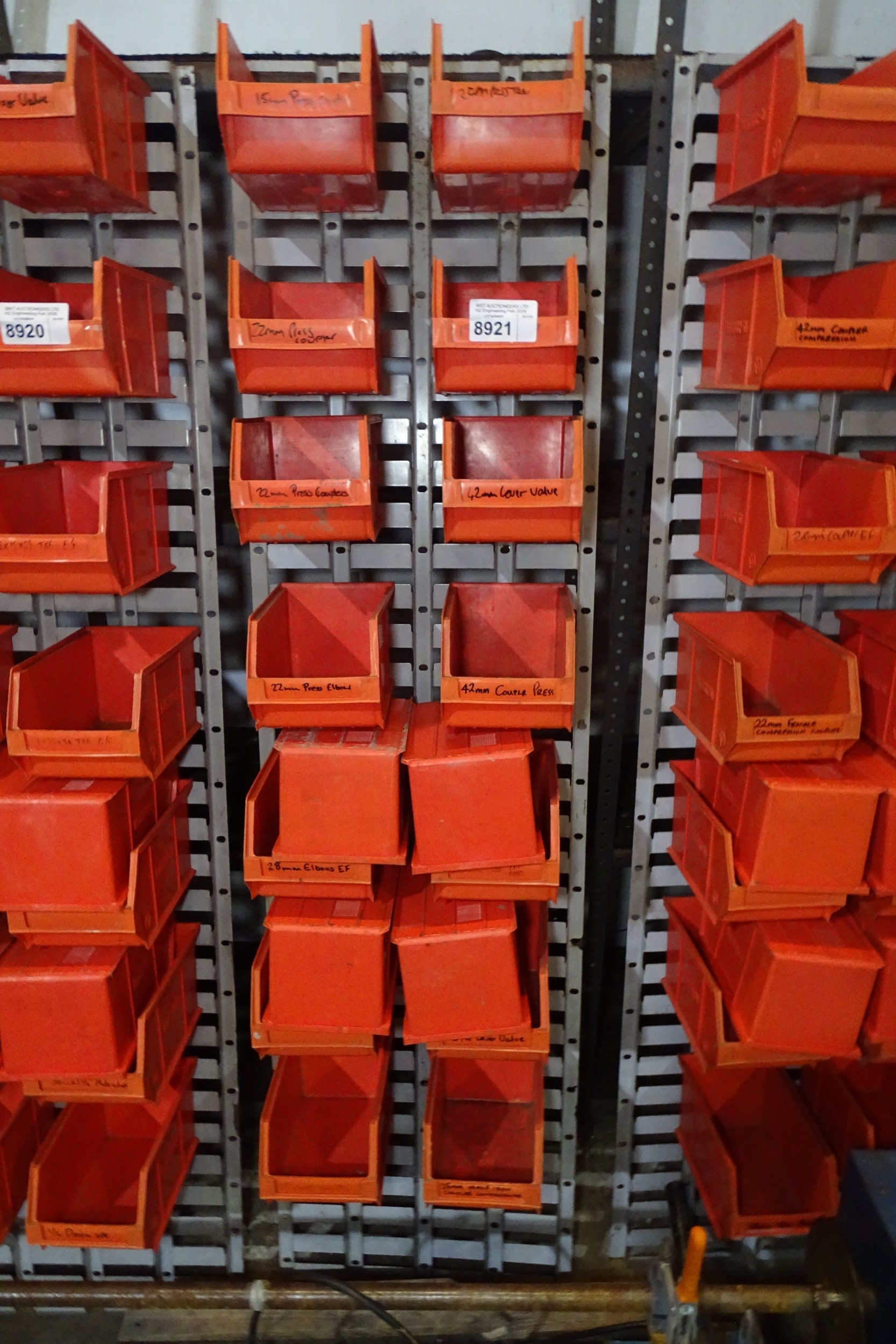 18 x Lin type bins and a metal lin bin rack approx 43.5cm w x 168cm h
