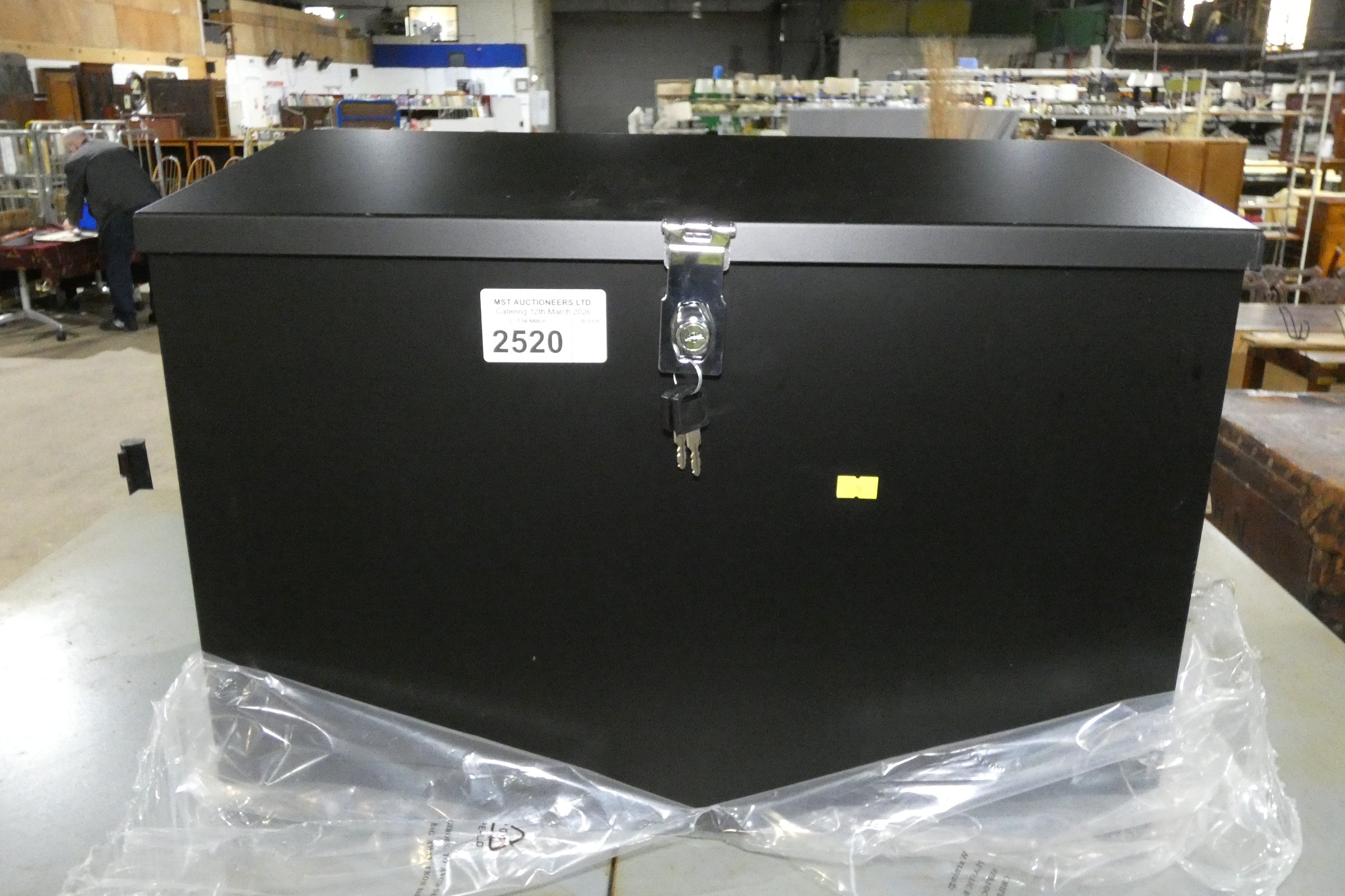 An unused metal lockable storage box