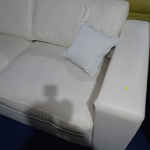 1110 - 1 x 3 Seater cream leather effect sofa approx 216cm wide