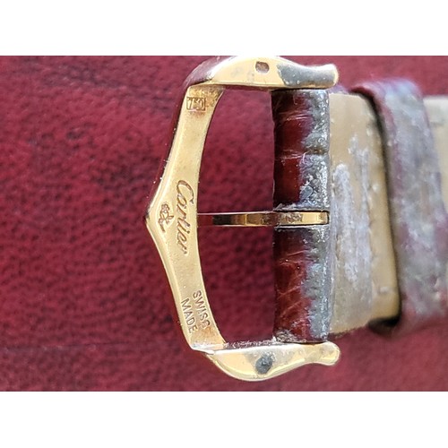 4212 - A Cartier Tank Solo small model gold & steel cased watch with quartz movement & leather stra... 