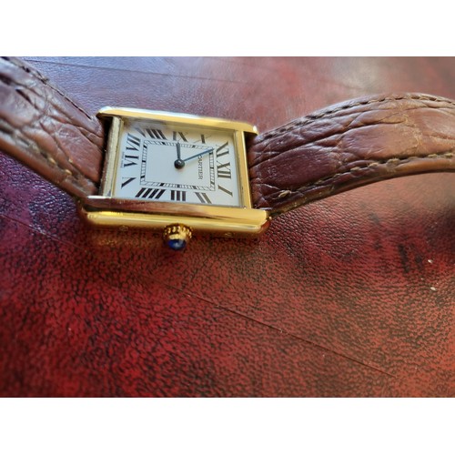 4212 - A Cartier Tank Solo small model gold & steel cased watch with quartz movement & leather stra... 
