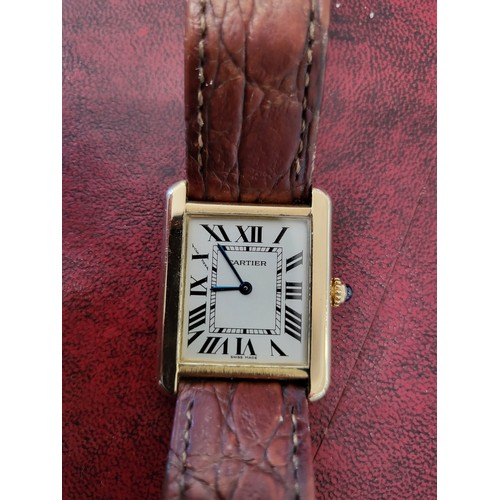 4212 - A Cartier Tank Solo small model gold & steel cased watch with quartz movement & leather stra... 