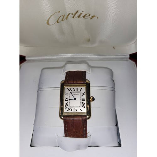 4212 - A Cartier Tank Solo small model gold & steel cased watch with quartz movement & leather stra... 