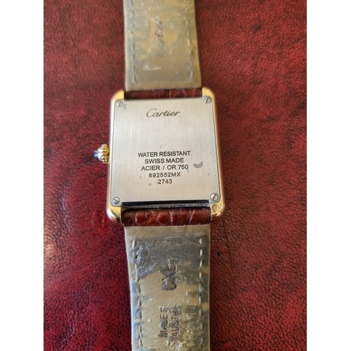 4212 - A Cartier Tank Solo small model gold & steel cased watch with quartz movement & leather stra... 