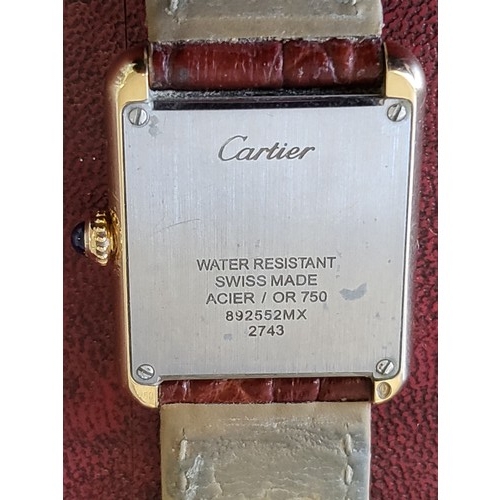 4212 - A Cartier Tank Solo small model gold & steel cased watch with quartz movement & leather stra... 
