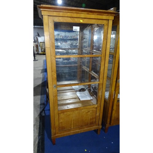 4482 - A pair of antique walnut Biedermeier style vitrine display cabinets, each with a glass door enclosin... 