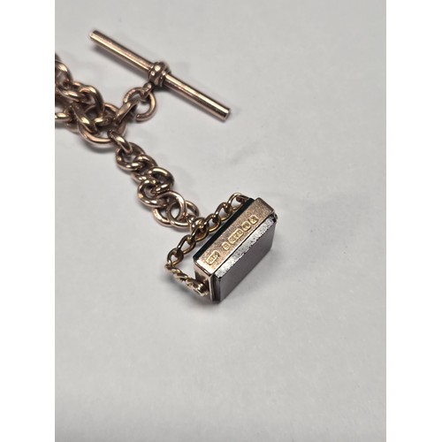 4210 - A 9 carat yellow gold Albert T bar chain and agate fob pendant, approximately 38cms long, weight app... 