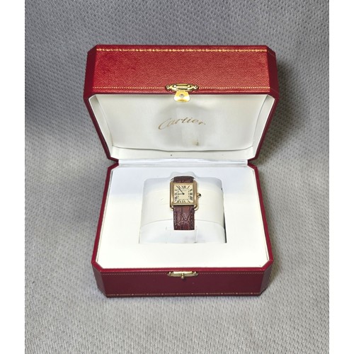 4212 - A Cartier Tank Solo small model gold &amp; steel cased watch with quartz movement &amp; leather stra...