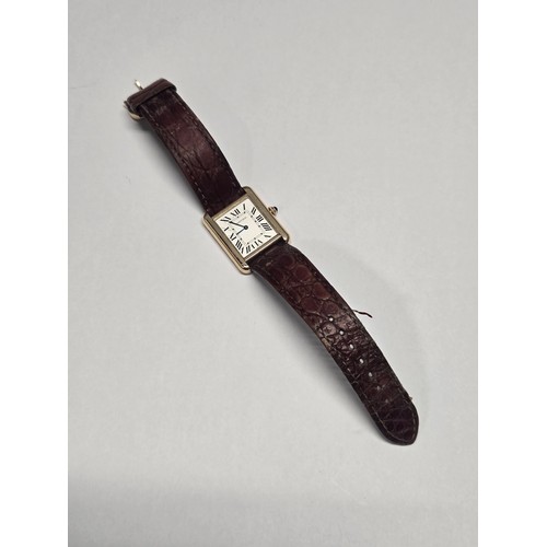 4212 - A Cartier Tank Solo small model gold & steel cased watch with quartz movement & leather stra... 