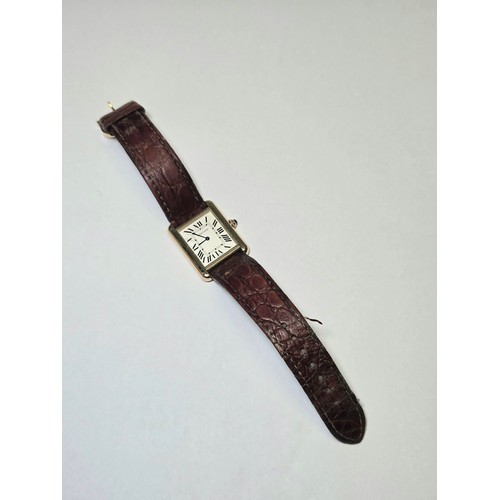 4212 - A Cartier Tank Solo small model gold & steel cased watch with quartz movement & leather stra... 