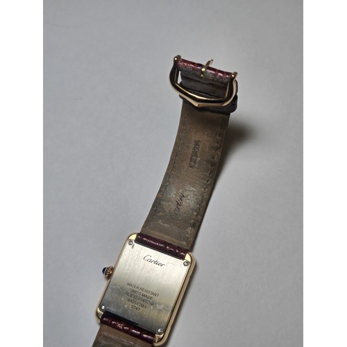 4212 - A Cartier Tank Solo small model gold & steel cased watch with quartz movement & leather stra... 